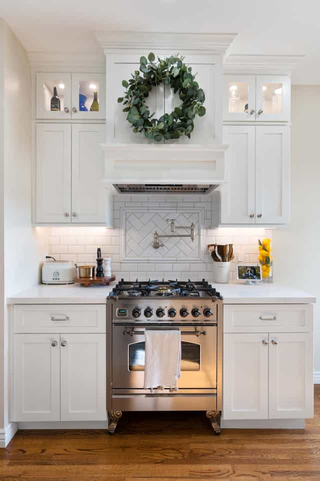 white counters with stainless steel appliance