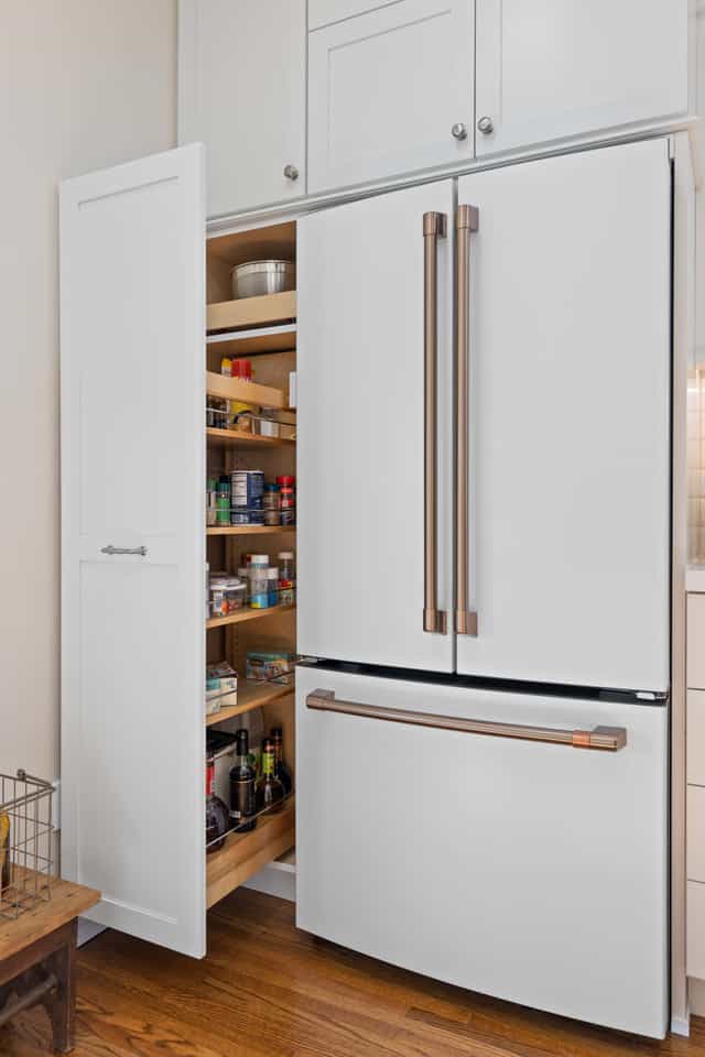 pull out pantry with white cabinets
