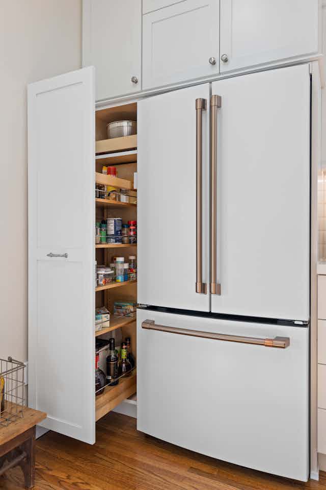 pull out pantry with white cabinets