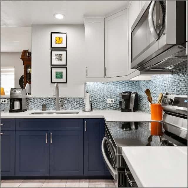 white counter with blue cabinets
